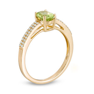 Oval Peridot and 0.116 CT. T.W. Diamond Double Row Ring in 14K Gold