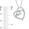 Thumbnail Image 1 of 0.067 CT. T.W. Diamond Double Tilted Heart with Square Knot Pendant in Sterling Silver