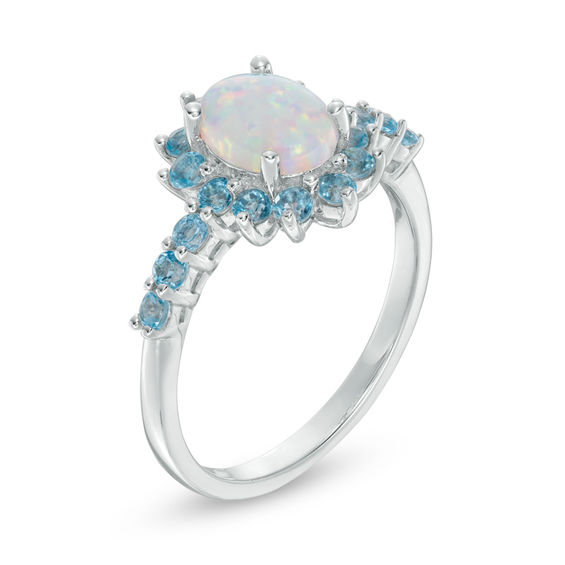 Oval Lab-Created Opal and Swiss Blue Topaz Starburst Frame Ring in Sterling Silver