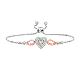1/15 CT. T.W. Diamond Double Heart with Wings Bolo Bracelet in Sterling Silver and 10K Rose Gold (1 Line) - 9.5&quot;