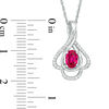 Oval Lab-Created Ruby and 0.148 CT. T.W. Diamond Teardrop Frame Leaf Pendant in 10K White, Yellow or Rose Gold