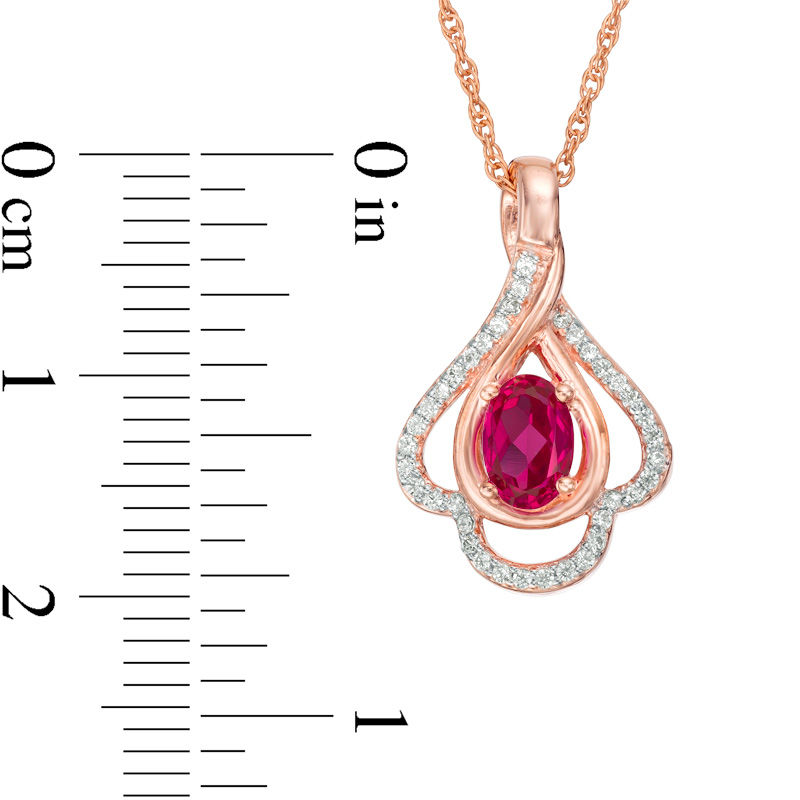 Oval Lab-Created Ruby and 0.148 CT. T.W. Diamond Teardrop Frame Leaf Pendant in 10K White, Yellow or Rose Gold|Peoples Jewellers