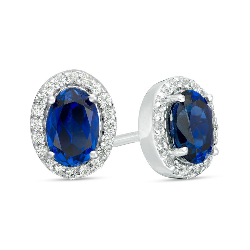 Oval Lab-Created Blue Sapphire and 0.14 CT. T.W. Diamond Frame Stud Earrings in 10K White Gold|Peoples Jewellers