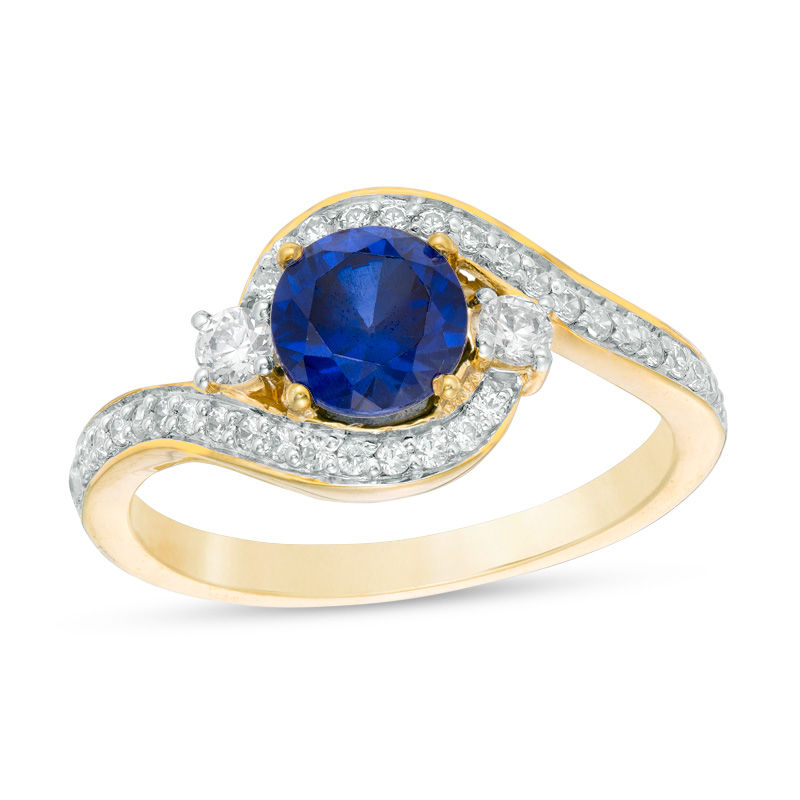 6.0mm Lab-Created Blue Sapphire and 0.23 CT. T.W. Diamond Three Stone Bypass Ring in 10K Gold|Peoples Jewellers