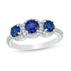 Thumbnail Image 0 of Lab-Created Blue Sapphire and 0.23 CT. T.W. Diamond Frame Three Stone Ring in 10K White Gold