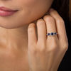 Lab-Created Blue Sapphire and 0.23 CT. T.W. Diamond Frame Three Stone Ring in 10K White, Yellow or Rose Gold