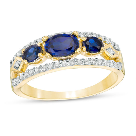 Sideways Oval Lab-Created Blue Sapphire and 0.23 CT. T.W. Diamond Three Stone Ring in 10K Gold