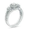 0.95 CT. T.W. Diamond Three Stone Frame Bridal Set in 10K White Gold