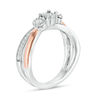 0.29 CT. T.W. Diamond Three Stone Crossover Engagement Ring in Sterling Silver and 10K Rose Gold