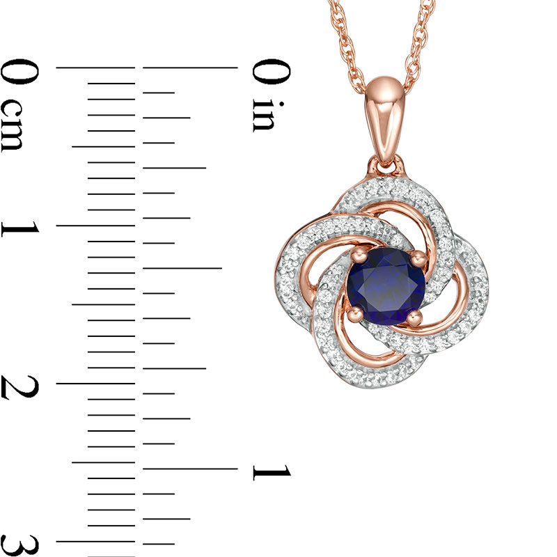 5.0mm Lab-Created Blue Sapphire and 0.145 CT. T.W. Diamond Flower Swirl Frame Pendant in 10K Rose Gold|Peoples Jewellers