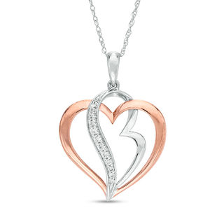 0.10 CT. T.W. Diamond Double Heart Pendant in 10K Two-Tone Gold