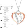 0.10 CT. T.W. Diamond Double Heart Pendant in 10K Two-Tone Gold