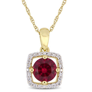 Oval Ruby and 0.04 CT. T.W. Diamond Tri-Top Pendant in 10K Gold