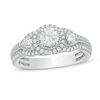 0.88 CT. T.W. Certified Canadian Diamond Three Stone Frame Vintage-Style Engagement Ring in 14K White Gold (I/I2)