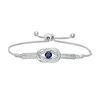 Thumbnail Image 0 of 5.0mm Lab-Created Blue Sapphire and 0.085 CT. T.W. Diamond Loop Knot Frame Bolo Bracelet in Sterling Silver - 9.5"