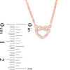 0.066 CT. T.W. Diamond Love Knot Heart Necklace in 10K Rose Gold - 17.6"