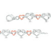 Thumbnail Image 1 of 0.085 CT. T.W. Diamond Love Knot Heart Bracelet in Sterling Silver and 10K Rose Gold