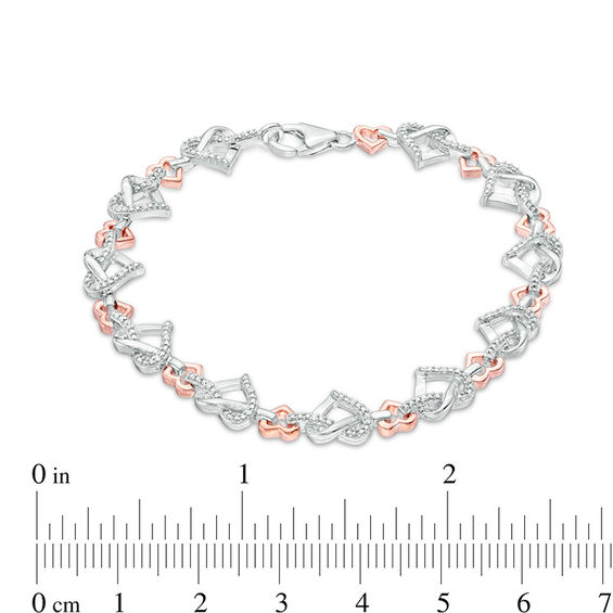 0.085 CT. T.W. Diamond Love Knot Heart Bracelet in Sterling Silver and 10K Rose Gold