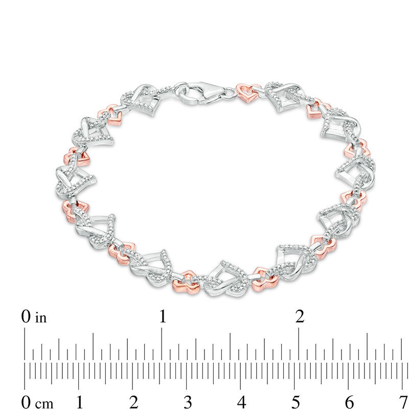 0.085 CT. T.W. Diamond Love Knot Heart Bracelet in Sterling Silver and 10K Rose Gold|Peoples Jewellers