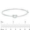 Thumbnail Image 1 of 0.065 CT. T.W. Diamond Love Knot Pretzel Bangle in Sterling Silver
