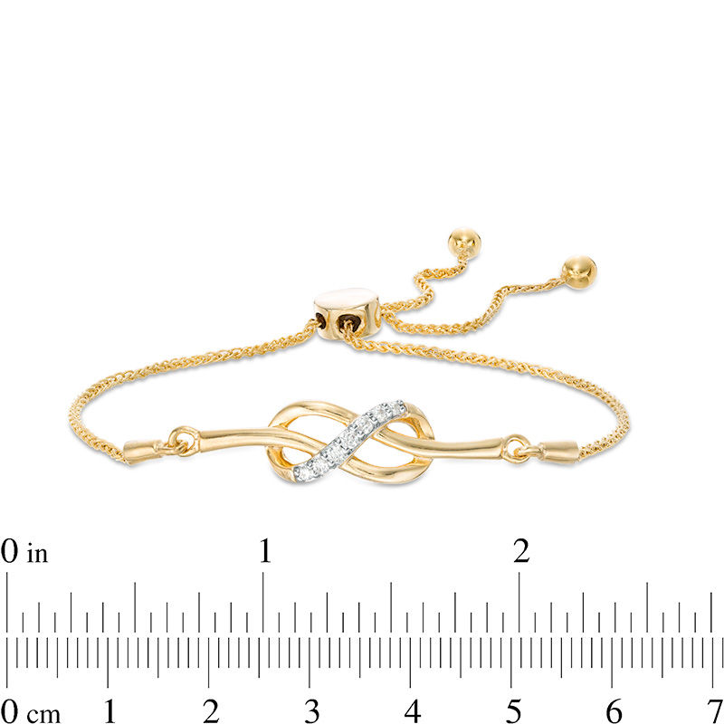 0.145 CT. T.W. Diamond Infinity Knot Bolo Bracelet in Sterling Silver with 14K Gold Plate - 9.5"|Peoples Jewellers
