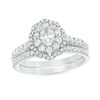 1.00 CT. T.W. Oval Diamond Double Scallop Frame Bridal Set in 14K White Gold