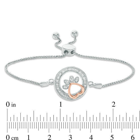 0.065 CT. T.W. Diamond Open Circle Paw Print Bolo Bracelet in Sterling Silver and 10K Rose Gold - 9.5"