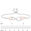 0.04 CT. T.W. Diamond Interlocking Sideways Heart and Infinity Bolo Bracelet in Sterling Silver and 10K Rose Gold - 9.5"