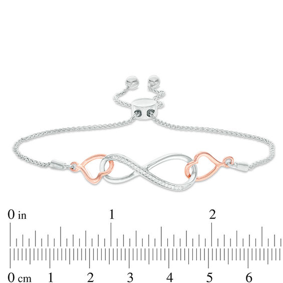 0.04 CT. T.W. Diamond Interlocking Sideways Heart and Infinity Bolo Bracelet in Sterling Silver and 10K Rose Gold - 9.5"