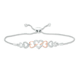 0.04 CT. T.W. Diamond Intertwining Sideways Heart Bolo Bracelet in Sterling Silver and 10K Rose Gold - 9.5&quot;