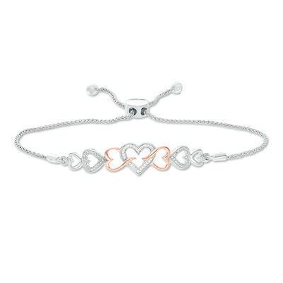 0.04 CT. T.W. Diamond Intertwining Sideways Heart Bolo Bracelet in Sterling Silver and 10K Rose Gold - 9.5"