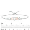 0.04 CT. T.W. Diamond Intertwining Sideways Heart Bolo Bracelet in Sterling Silver and 10K Rose Gold - 9.5"