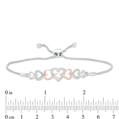 0.04 CT. T.W. Diamond Intertwining Sideways Heart Bolo Bracelet in Sterling Silver and 10K Rose Gold - 9.5"