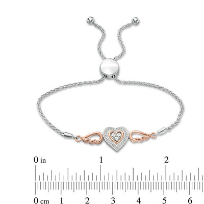 0.066 CT. T. W. Composite Diamond Double Heart Winged Bolo Bracelet in Sterling Silver and 10K Rose Gold - 9.5"