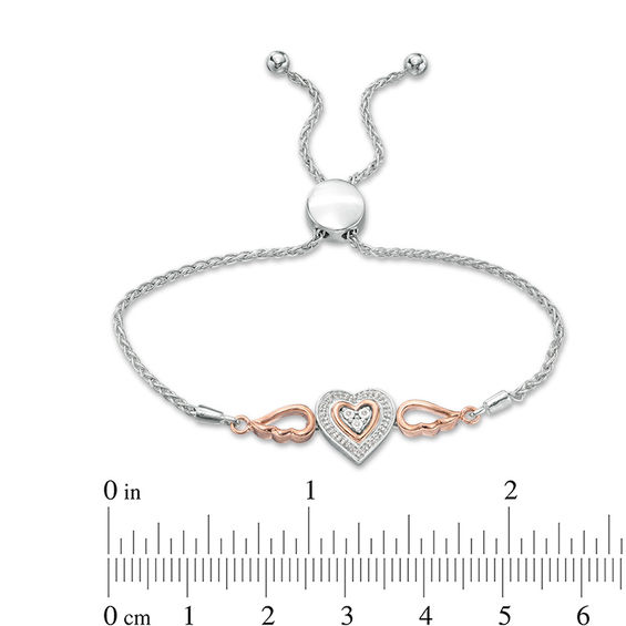 0.066 CT. T. W. Composite Diamond Double Heart Winged Bolo Bracelet in Sterling Silver and 10K Rose Gold - 9.5"