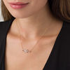 Thumbnail Image 1 of 0.18 CT. T.W. Diamond Woven Knot Necklace in 10K Gold - 17"