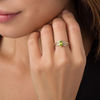 Pear-Shaped Peridot and 0.069 CT. T.W. Diamond Wave Ring in 10K Gold