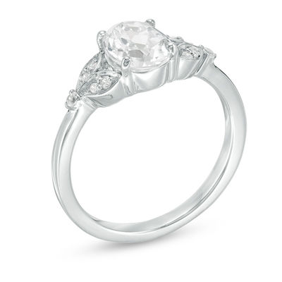 Oval Lab-Created White Sapphire and 0.086 CT. T.W. Diamond Leaf Sides Ring in Sterling Silver