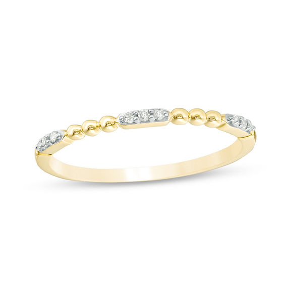 0.05 CT. T.W. Diamond and Beaded Station Anniversary Band in 10K Gold