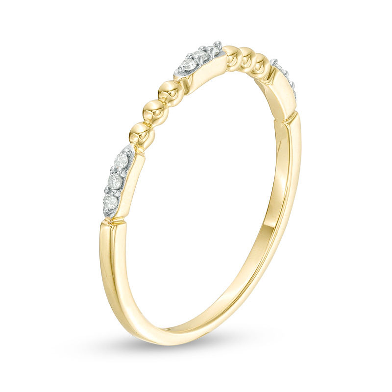 0.05 CT. T.W. Diamond and Beaded Station Anniversary Band in 10K Gold