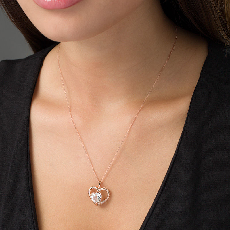 10.0mm Lab-Created White Sapphire and 0.08 CT. T.W. Diamond Heart Pendant in 10K Rose Gold|Peoples Jewellers