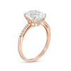 Thumbnail Image 1 of Oval Lab-Created White Sapphire and 0.04 CT. T.W. Diamond Ring in 10K Rose Gold