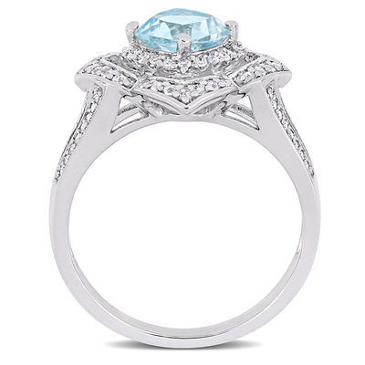 6.0mm Cushion-Cut Blue Topaz and 0.19 CT. T.W. Diamond Flower Frame Split Shank Ring in Sterling Silver