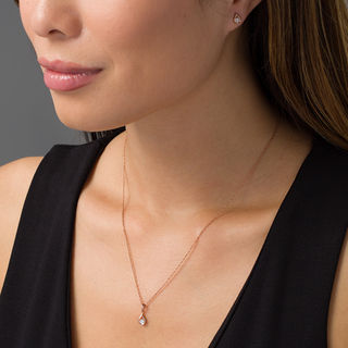 CT. T.W. Diamond Solitaire Teardrop Flame Pendant and Stud Earrings Set in 10K Rose Gold