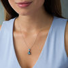 Pear-Shaped Blue Topaz and 0.23 CT. T.W. Enhanced Black and White Diamond Frame Drop Pendant in Sterling Silver