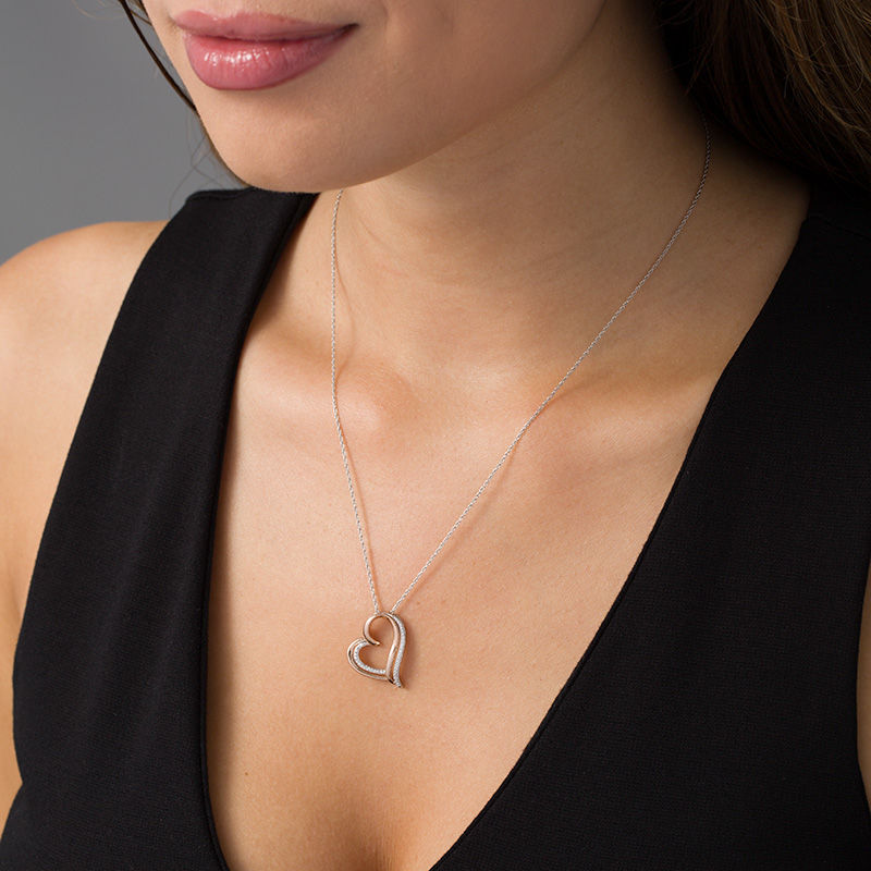0.04 CT. T.W. Diamond Tilted Double Heart Pendant in Sterling Silver and 10K Rose Gold|Peoples Jewellers