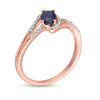 Thumbnail Image 2 of Oval Lab-Created Blue Sapphire and 0.065 CT. T.W. Diamond Swirling Bypass Split Shank Promise Ring in 10K Rose Gold