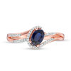 Oval Lab-Created Blue Sapphire and 0.065 CT. T.W. Diamond Swirling Bypass Split Shank Promise Ring in 10K Rose Gold