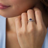 Sideways Oval Lab-Created Blue Sapphire and 0.04 CT. T.W. Diamond Crossover Ribbon Promise Ring in Sterling Silver