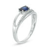 Sideways Oval Lab-Created Blue Sapphire and 0.04 CT. T.W. Diamond Crossover Ribbon Promise Ring in Sterling Silver